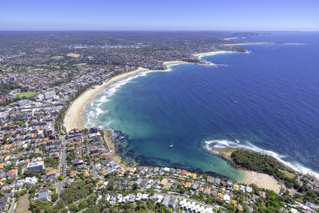 Aerial view of the Northern Beaches Sydney coastline, featuring sandy beaches, residential suburbs and the Pacific Ocean.